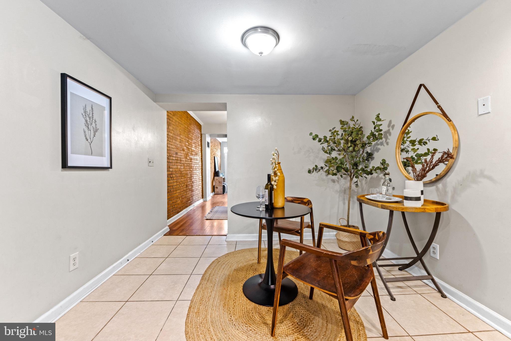 1505 South Hanover Street Baltimore, MD 21230 - Photo 11 of 30 a view of a dining room with furniture and wooden floor