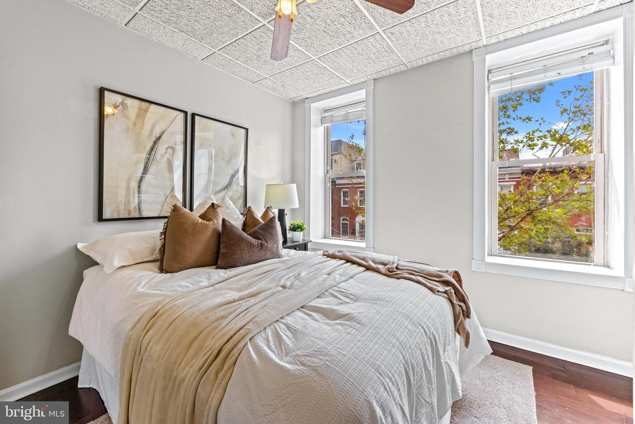 1505 South Hanover Street Baltimore, MD 21230 - Photo 18 of 30 a bedroom with a large bed and a window