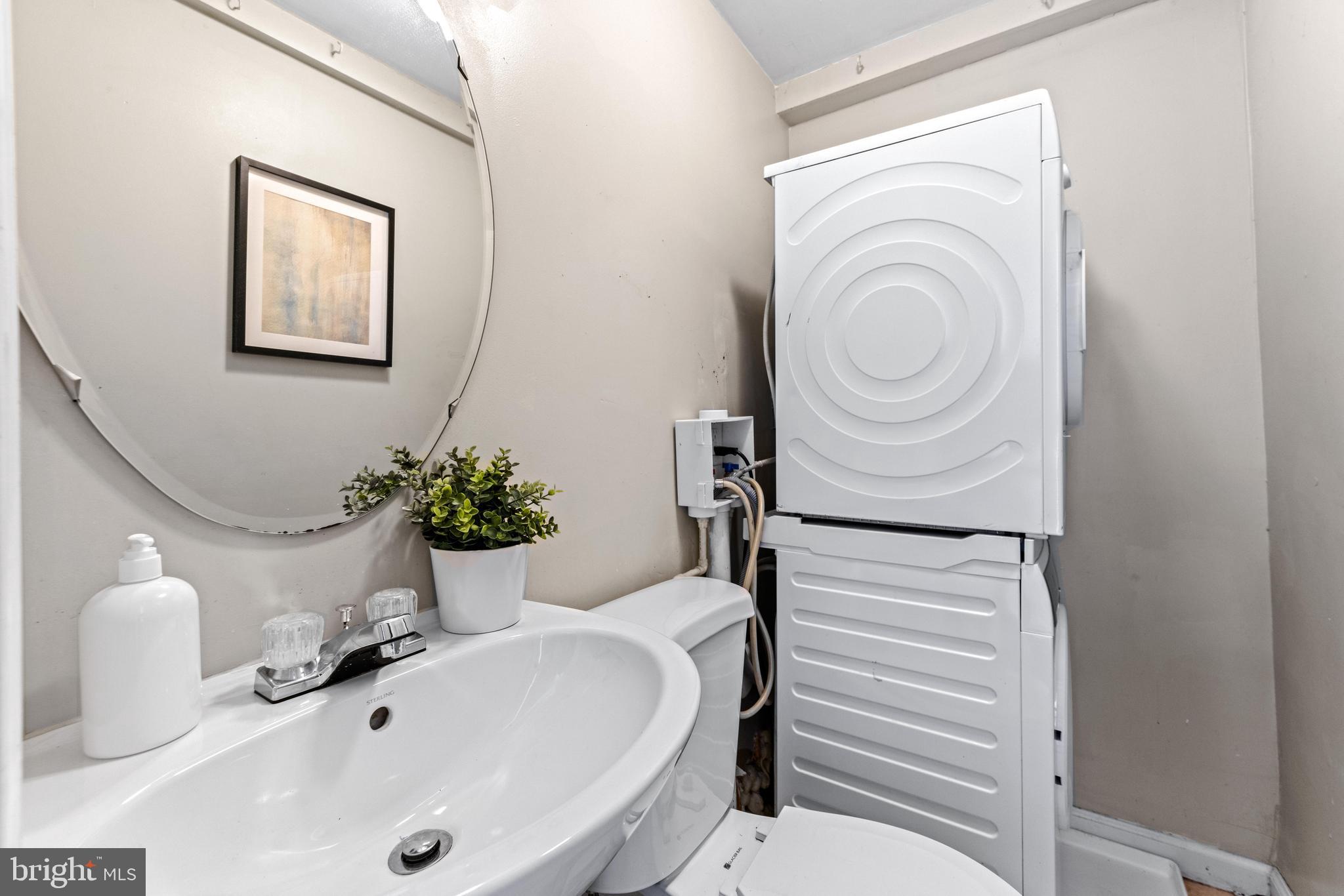 1505 South Hanover Street Baltimore, MD 21230 - Photo 19 of 30 a bathroom with a sink a toilet and shower