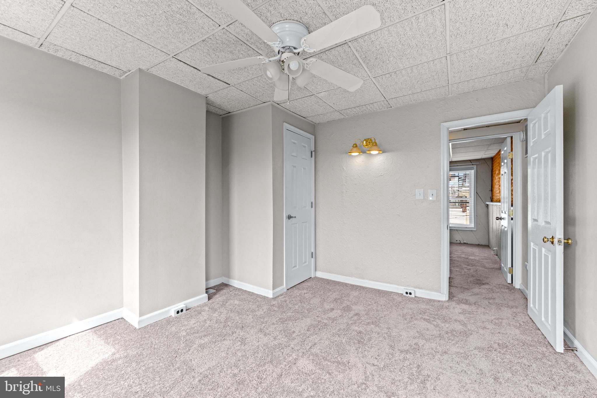 1505 South Hanover Street Baltimore, MD 21230 - Photo 22 of 30 an empty room with fan and entrance