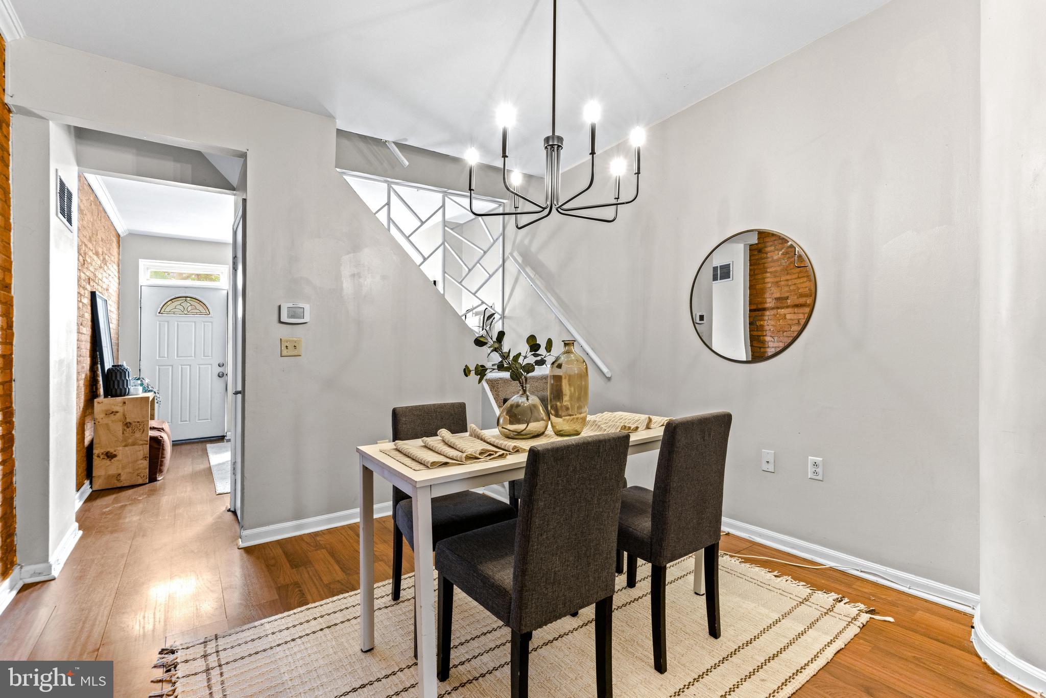 1505 South Hanover Street Baltimore, MD 21230 - Photo 5 of 30 a view of a dining room with furniture and a chandelier