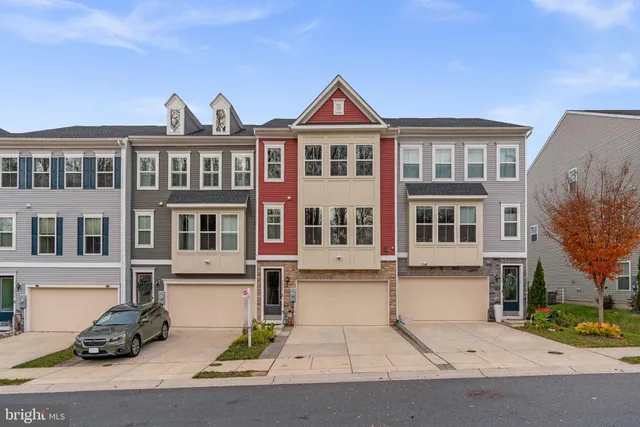 a front view of a building with many windows