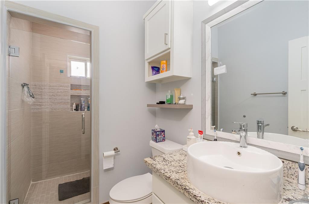 1609 Coyote Edinburg, TX 78541 - Photo 14 of 17 a bathroom with a sink toilet and shower