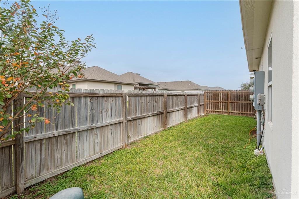 1609 Coyote Edinburg, TX 78541 - Photo 16 of 17 a view of a house with wooden floor and a yard