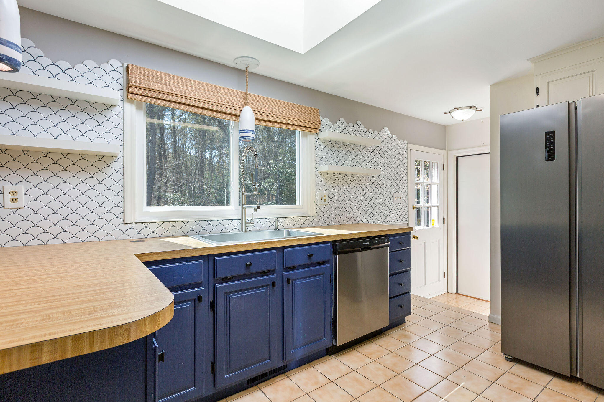 1197 Orleans-Harwich Road Harwich, MA 02645 - Photo 24 of 66 a large kitchen with stainless steel appliances granite countertop a refrigerator and a sink
