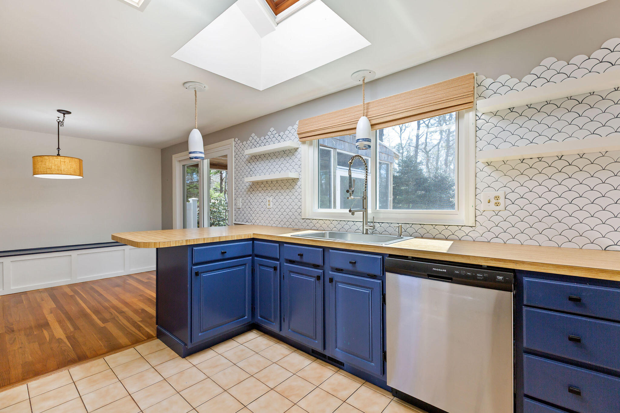 1197 Orleans-Harwich Road Harwich, MA 02645 - Photo 26 of 66 a kitchen with a sink and wooden cabinets