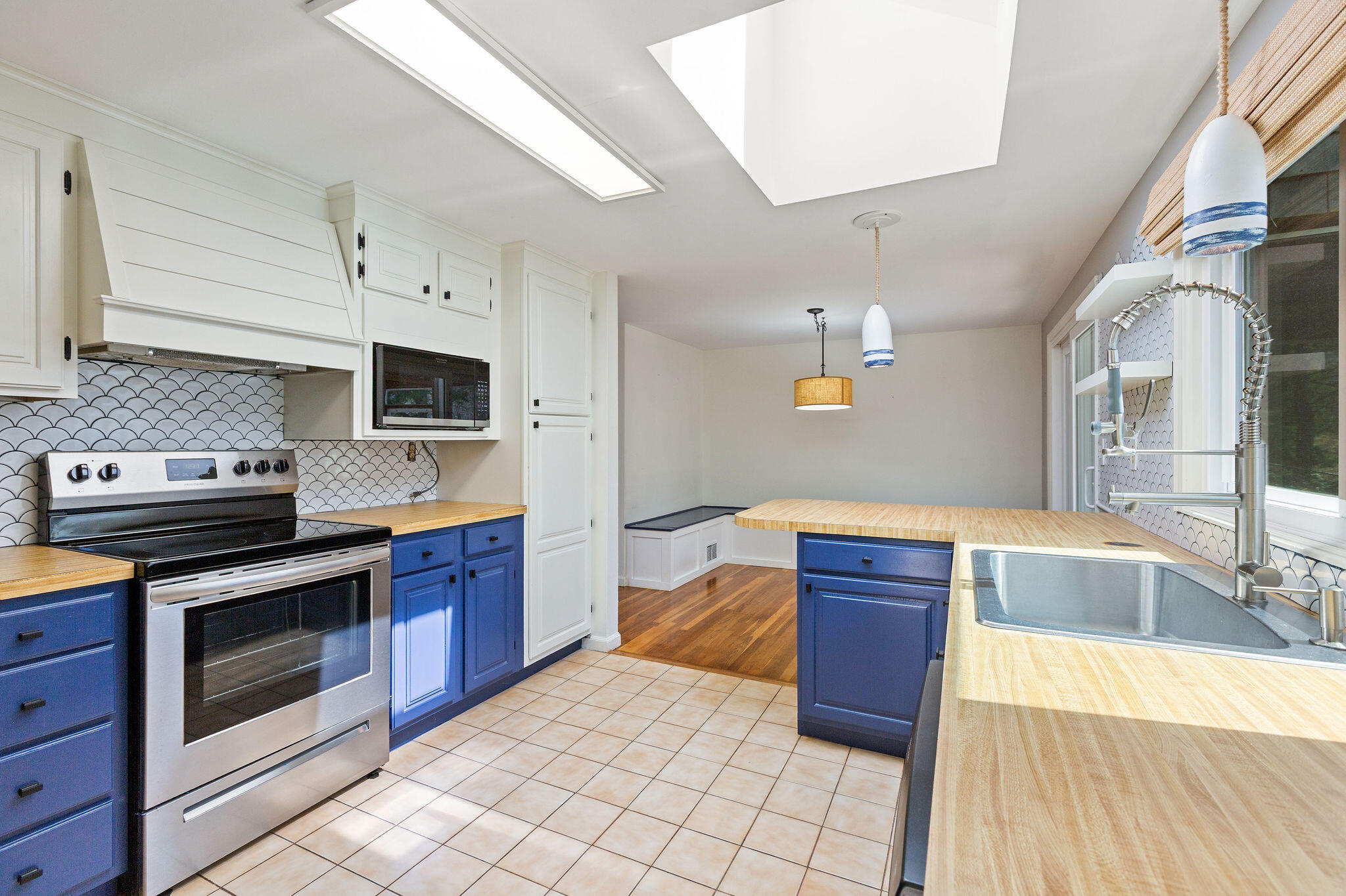 1197 Orleans-Harwich Road Harwich, MA 02645 - Photo 27 of 66 a kitchen with stainless steel appliances granite countertop a stove and a sink