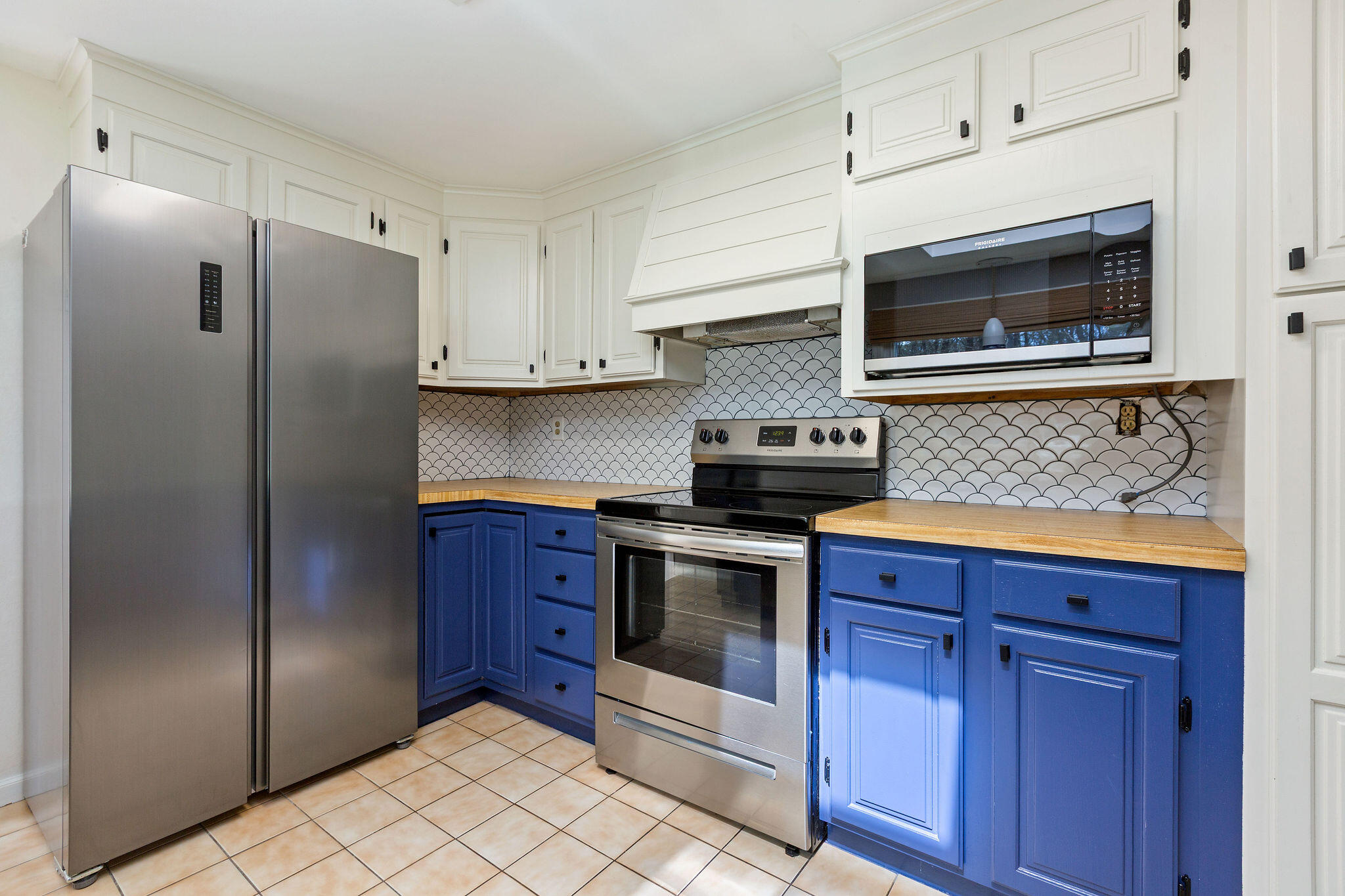 1197 Orleans-Harwich Road Harwich, MA 02645 - Photo 28 of 66 a kitchen with stainless steel appliances granite countertop a refrigerator stove and sink