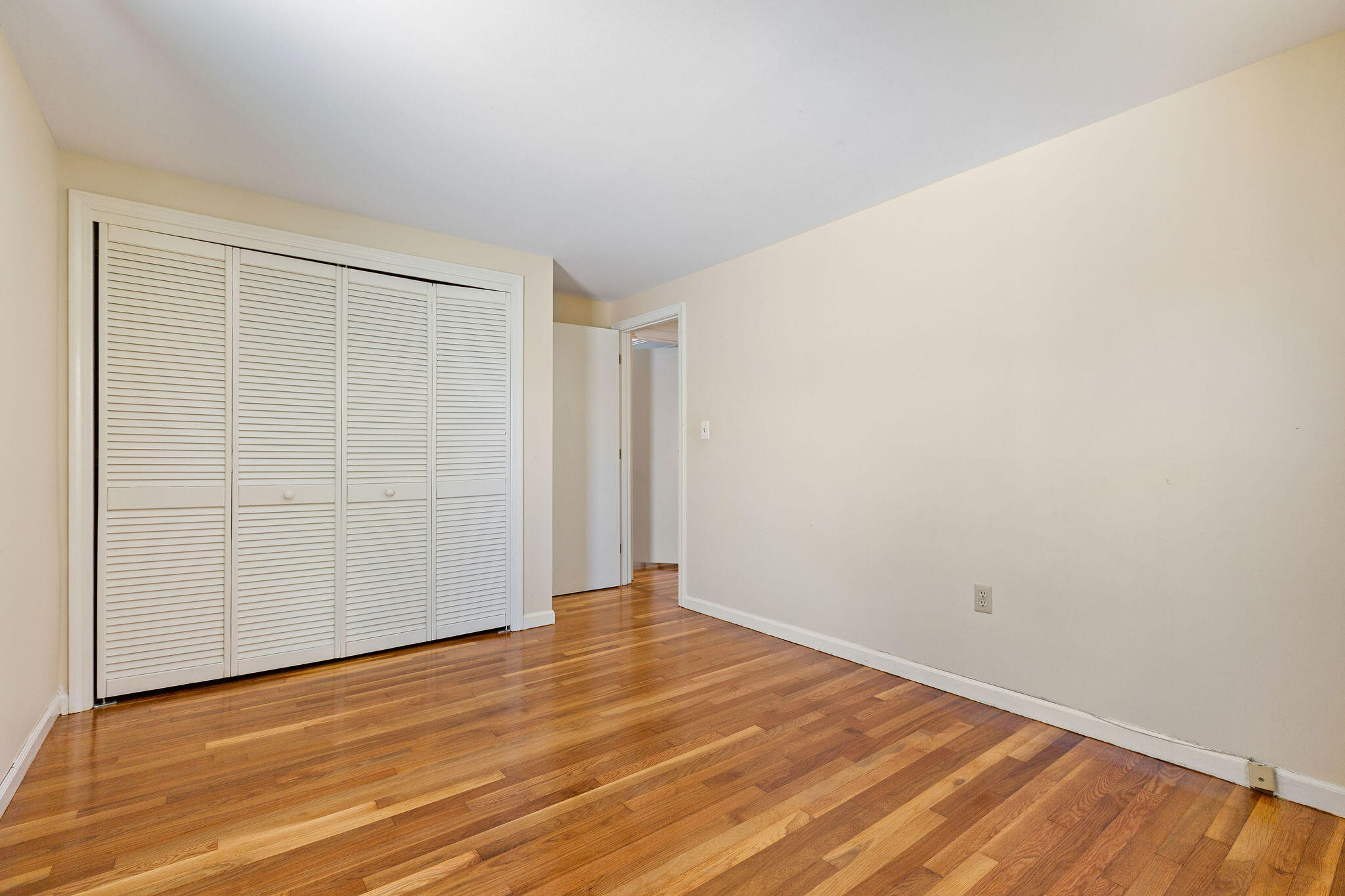 1197 Orleans-Harwich Road Harwich, MA 02645 - Photo 35 of 66 an empty room with wooden floor