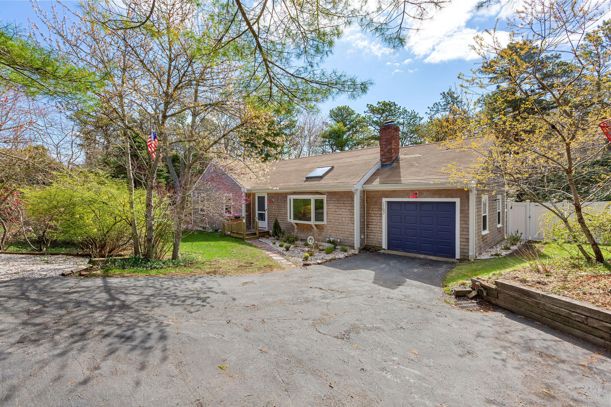 1197 Orleans-Harwich Road Harwich, MA 02645 - Photo 4 of 66 a front view of a house with a yard