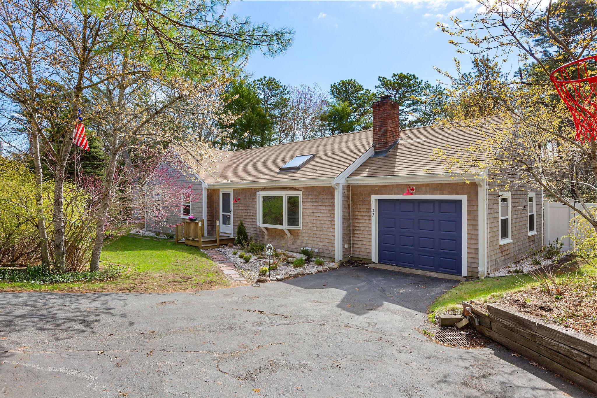 1197 Orleans-Harwich Road Harwich, MA 02645 - Photo 5 of 66 a front view of a house with garden
