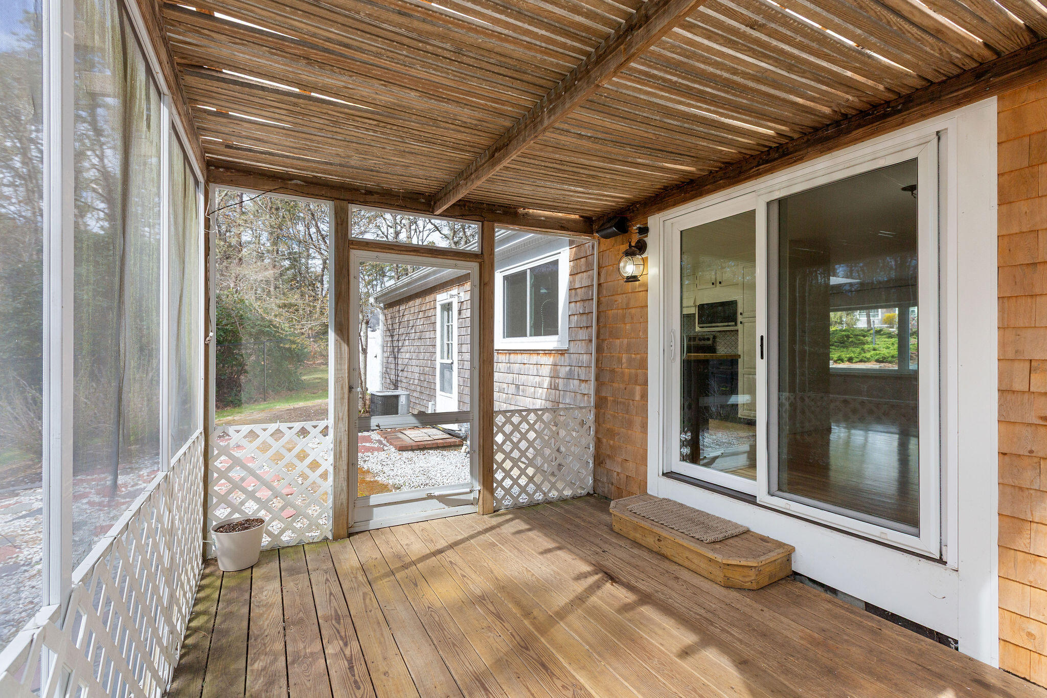 1197 Orleans-Harwich Road Harwich, MA 02645 - Photo 55 of 66 a view of a porch with wooden floor and outdoor space