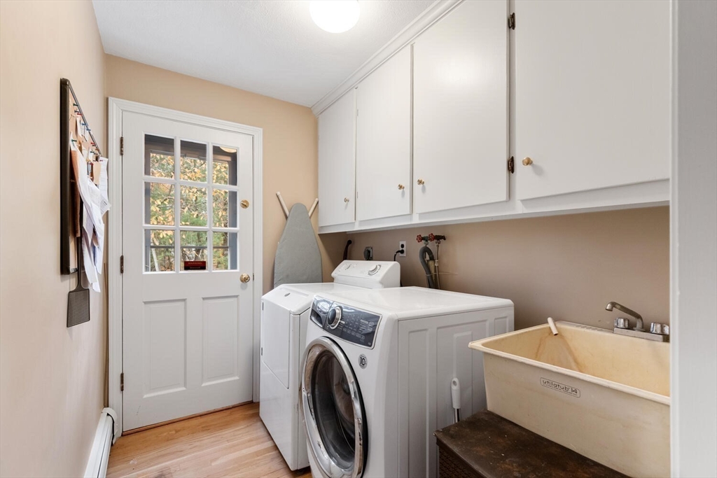31 Girard Road Winchester, MA 01890 - Photo 20 of 38 a utility room with dryer and washer