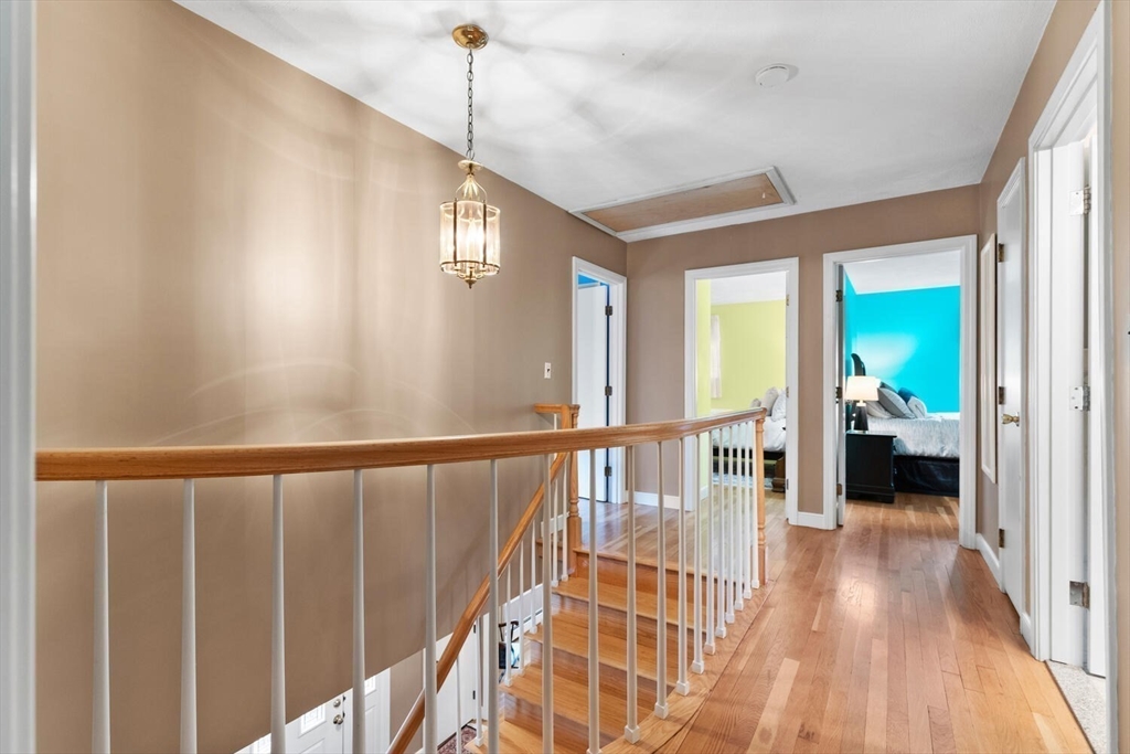 31 Girard Road Winchester, MA 01890 - Photo 21 of 38 a view of a hallway with wooden floor and stairs