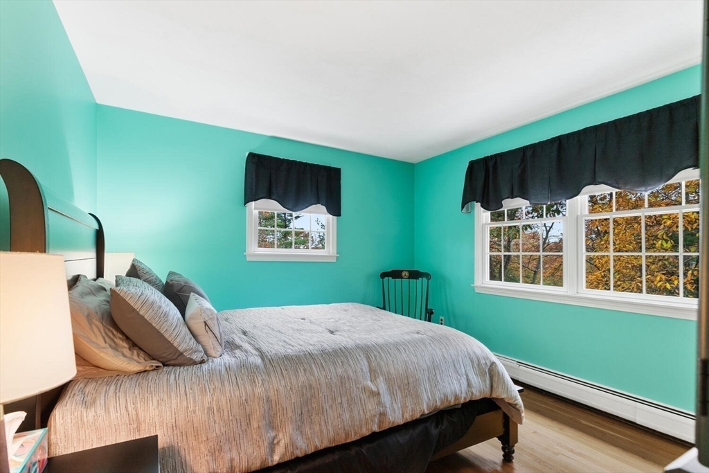 31 Girard Road Winchester, MA 01890 - Photo 25 of 38 a bedroom with a bed and a window