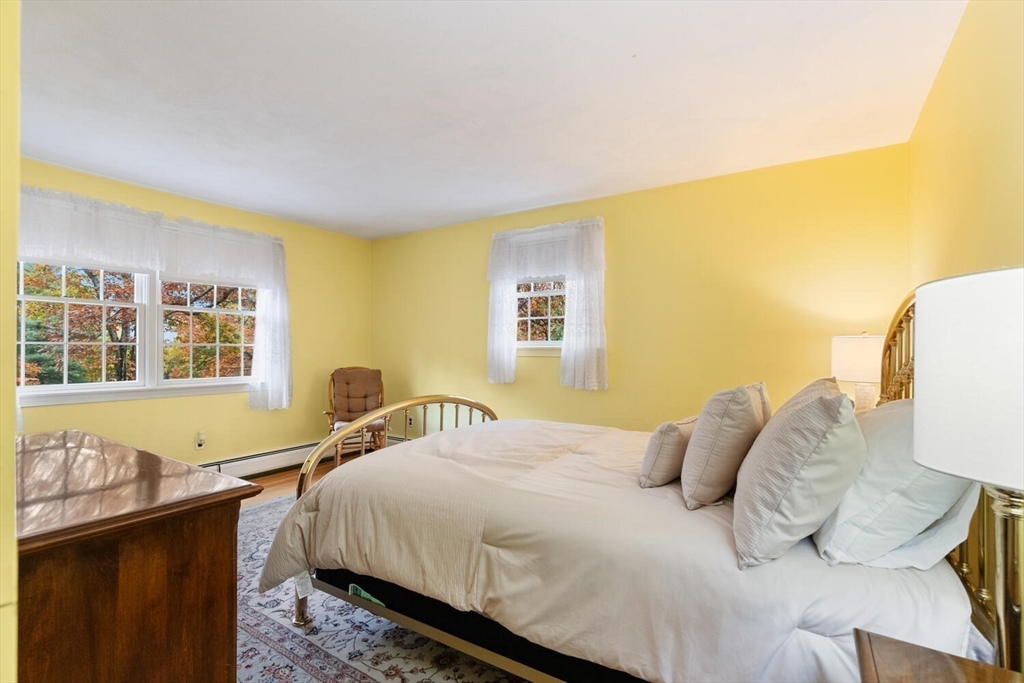 31 Girard Road Winchester, MA 01890 - Photo 27 of 38 a bedroom with a bed and a window