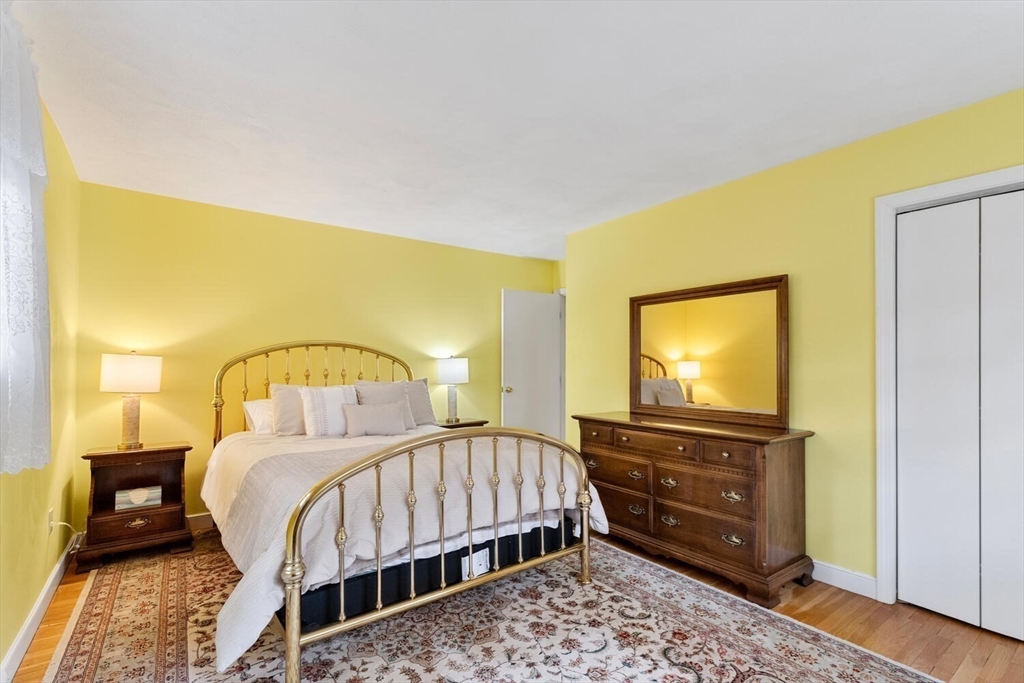 31 Girard Road Winchester, MA 01890 - Photo 28 of 38 a bed room with a bed and a television