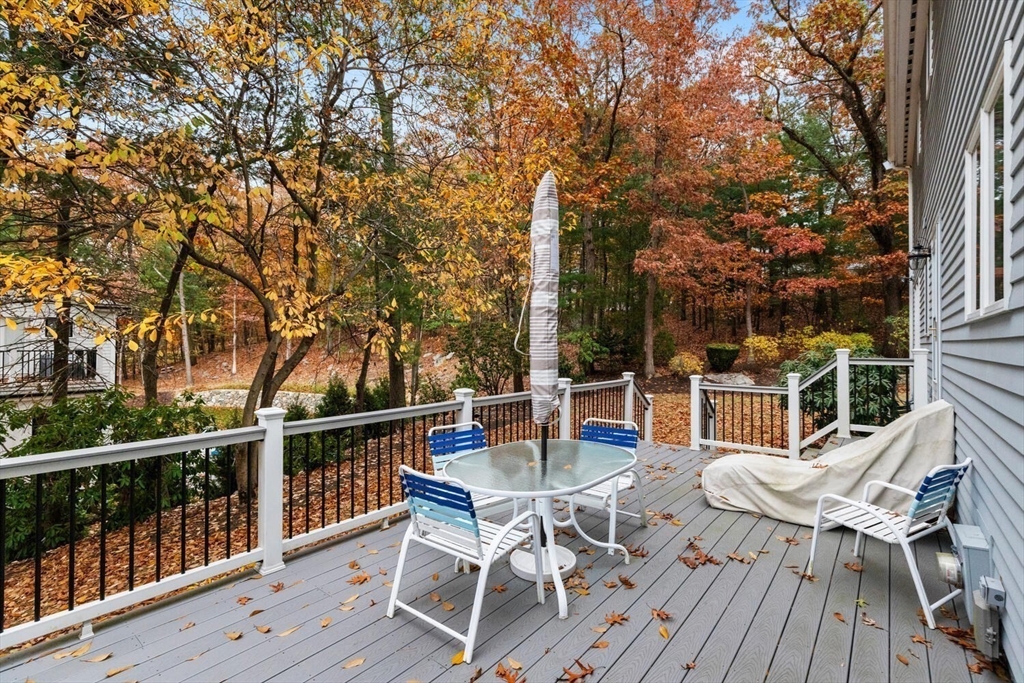 31 Girard Road Winchester, MA 01890 - Photo 32 of 38 a view of a chairs and table on the deck