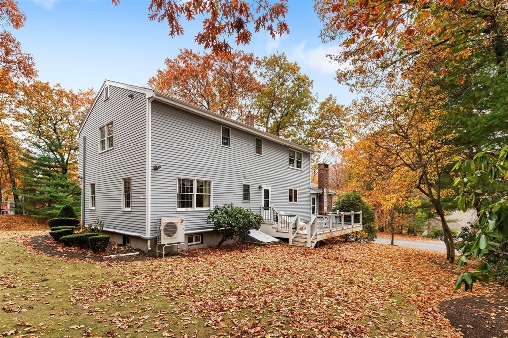 31 Girard Road Winchester, MA 01890 - Photo 33 of 38 a view of a house with a yard and sitting area