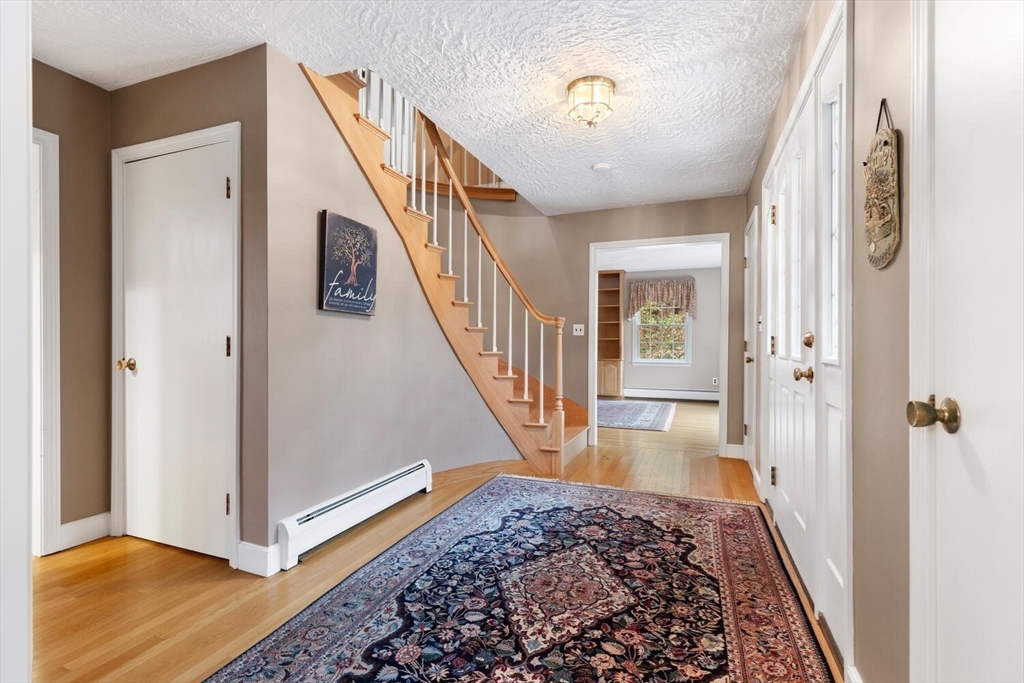 31 Girard Road Winchester, MA 01890 - Photo 5 of 38 a view of a hallway view with staircase and living room