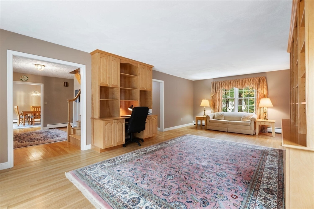 31 Girard Road Winchester, MA 01890 - Photo 7 of 38 a living room with furniture and a rug