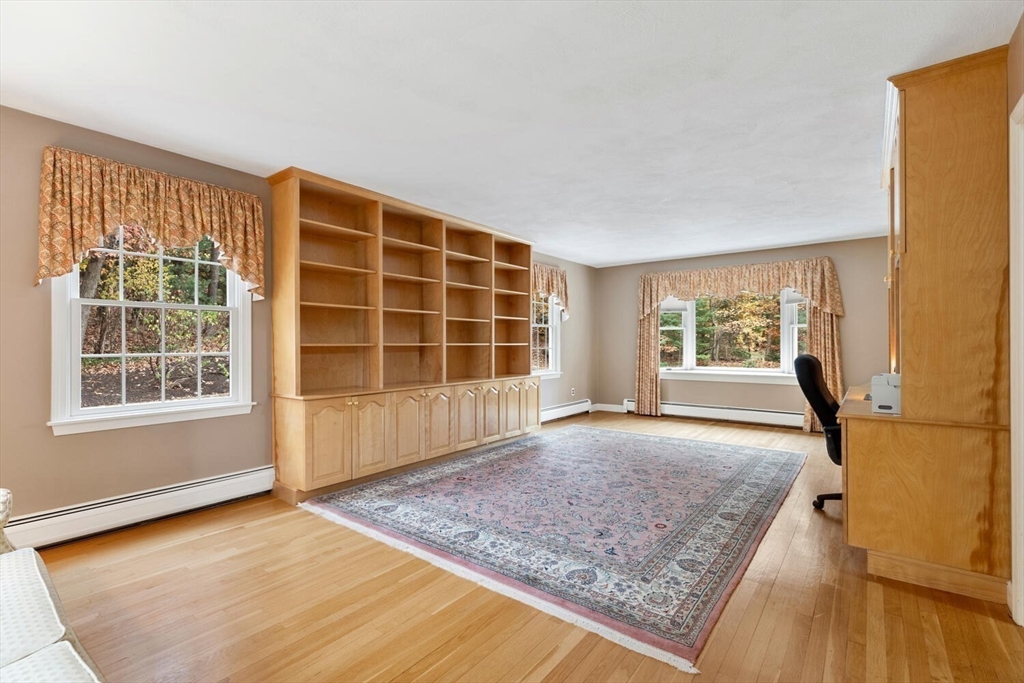 31 Girard Road Winchester, MA 01890 - Photo 8 of 38 a view of an empty room with a window and wooden floor