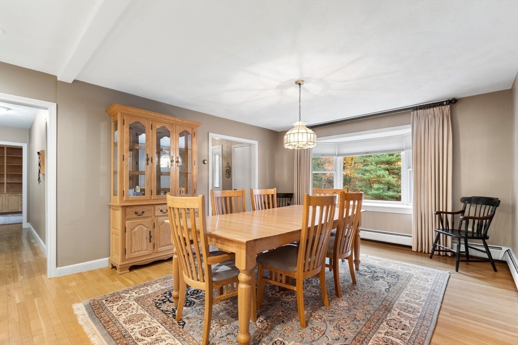 31 Girard Road Winchester, MA 01890 - Photo 10 of 38 a view of a dining room with furniture window and wooden floor