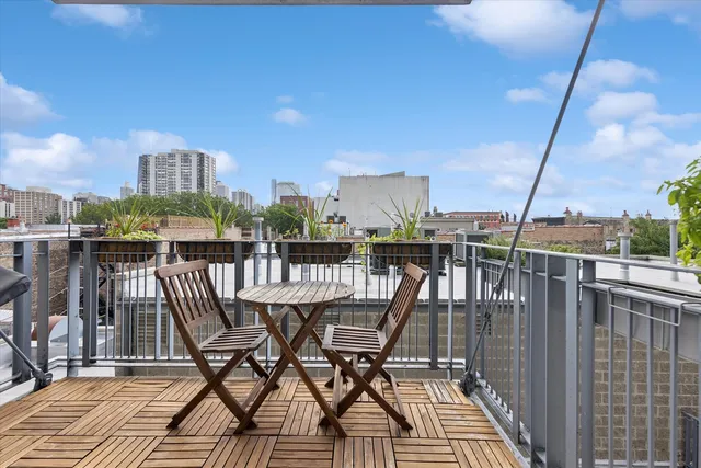 a view of a balcony with furniture