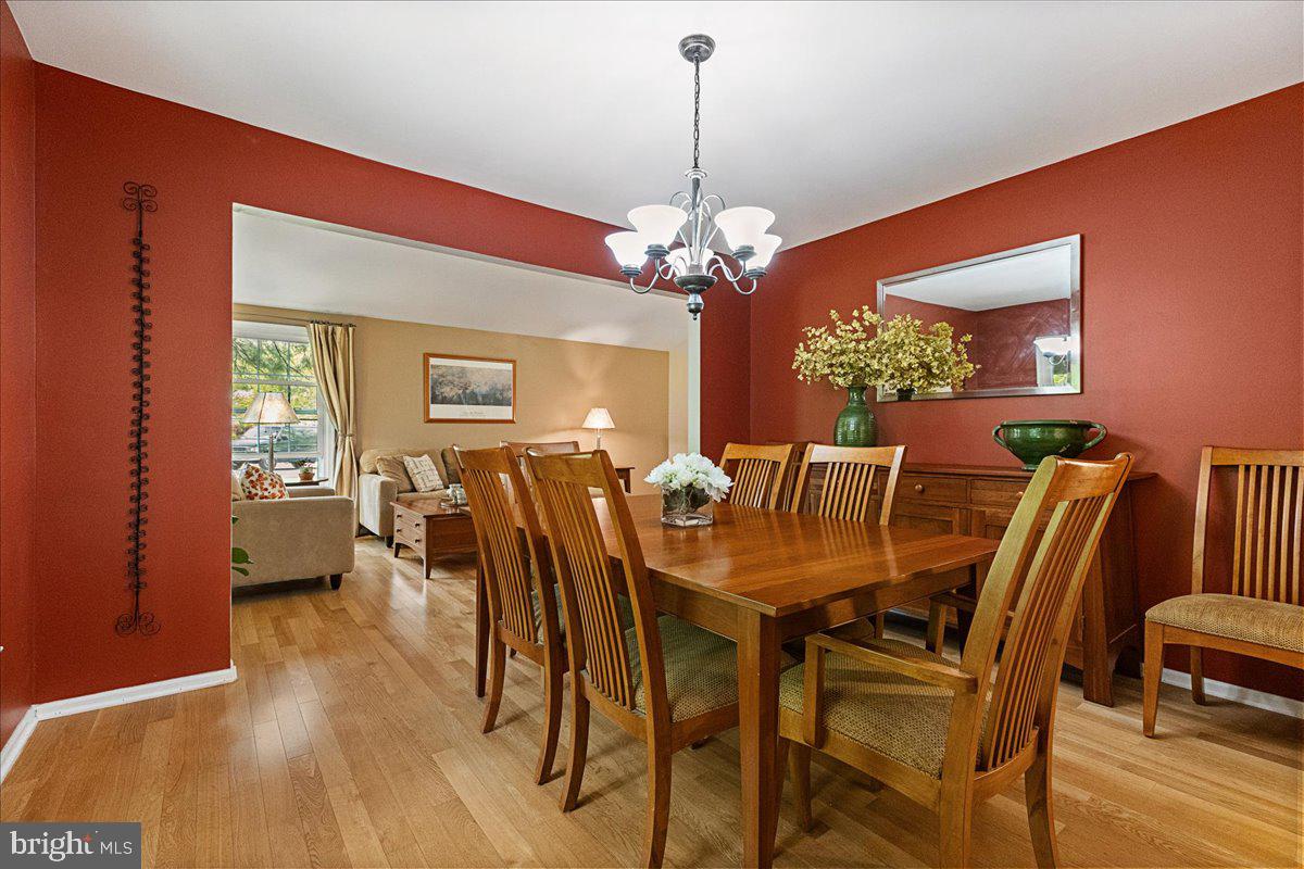 3 Strathmore Place Princeton Junction, NJ 08550 - Photo 11 of 29 a view of a dining room with furniture a chandelier and wooden floor