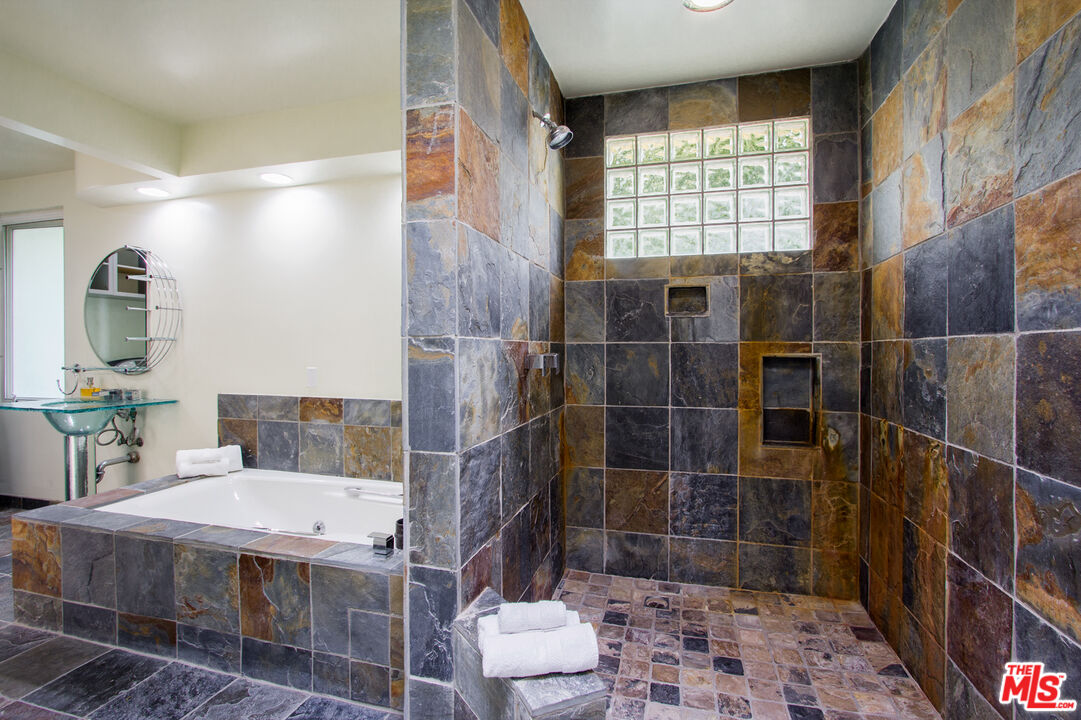 1244 Stradella Road Los Angeles, CA 90077 - Photo 16 of 18 a bathroom with a shower