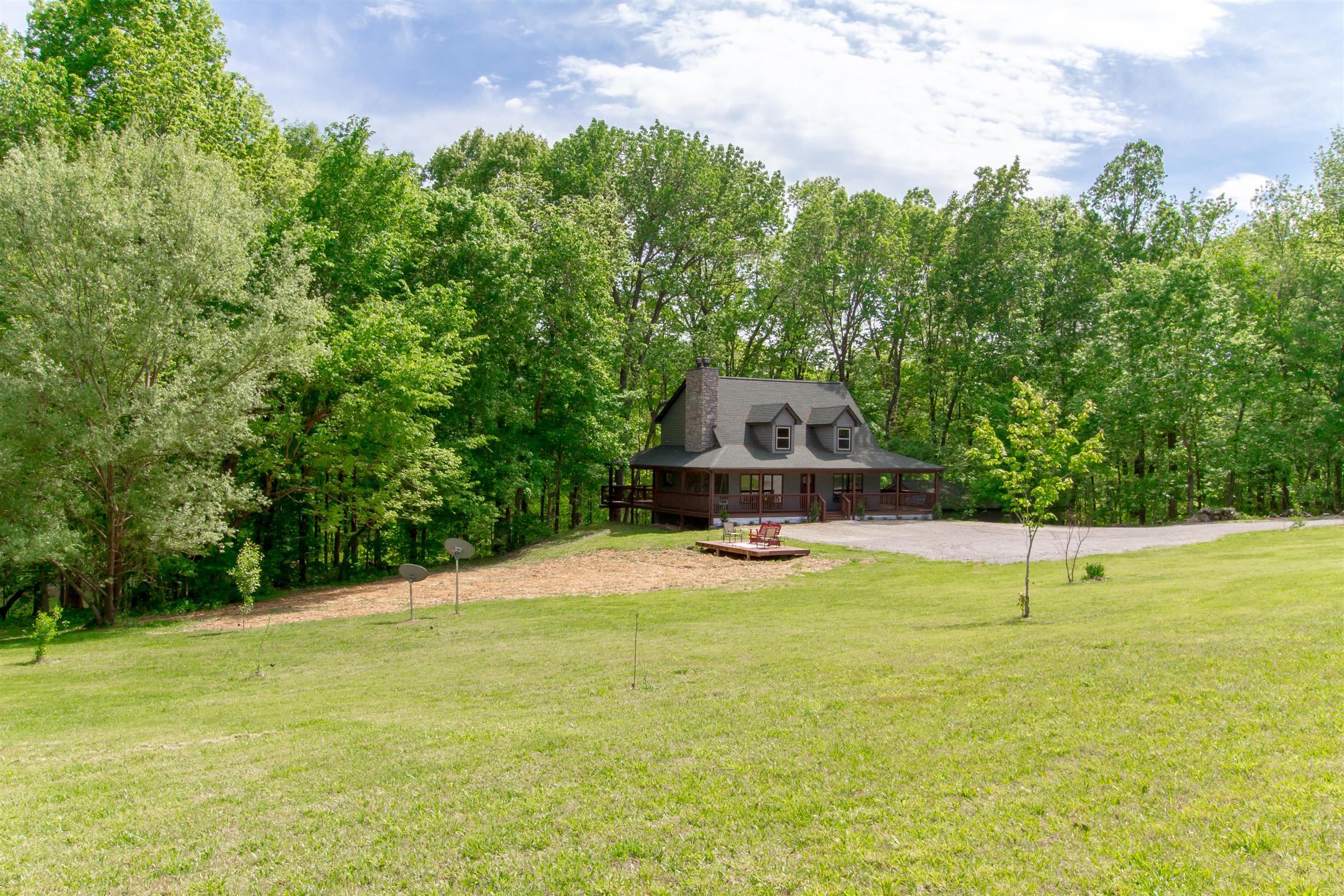 6353 Morton Road Greenbrier, TN 37073 - Photo 1 of 30 a small pool with trees in the background