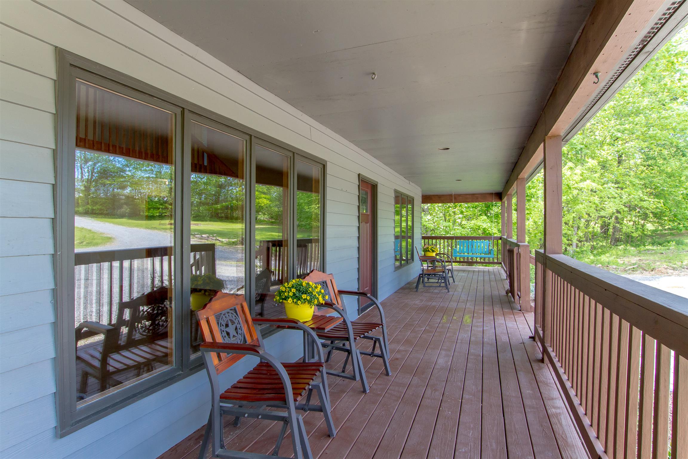 6353 Morton Road Greenbrier, TN 37073 - Photo 7 of 30 a view of a patio with chairs and wooden floor