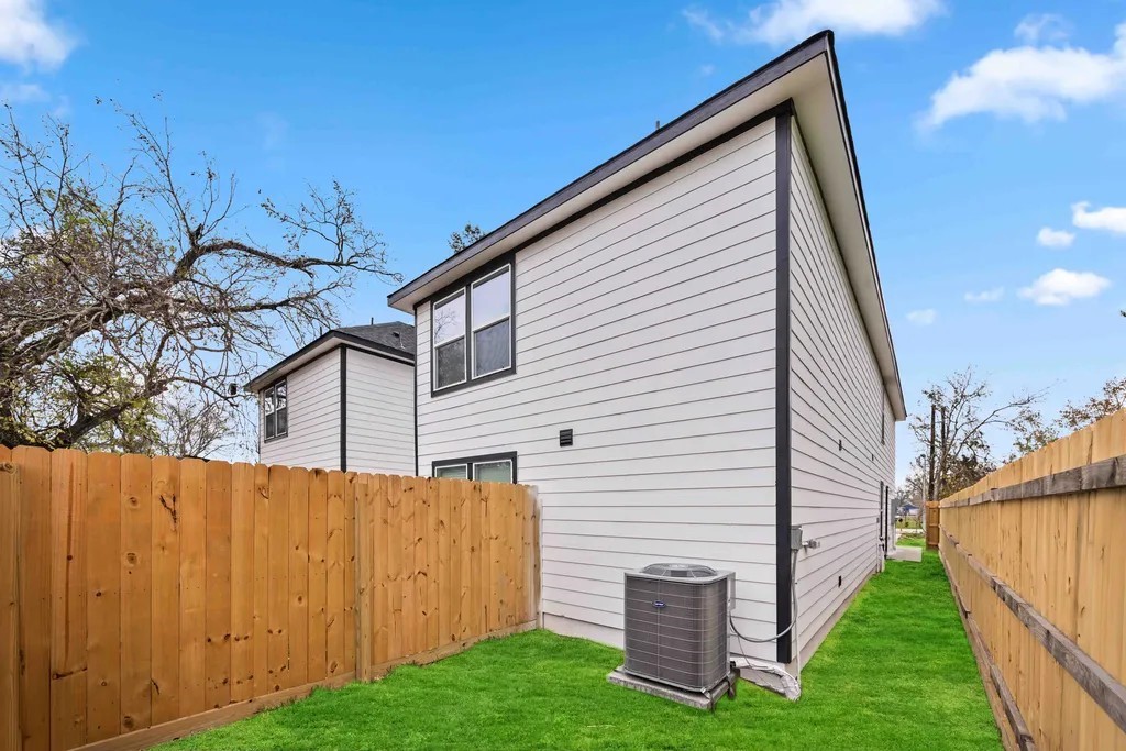 7811 Laura Koppe Road, Unit A Houston, TX 77028 - Photo 22 of 23 a view of backyard with barbeque grill potted plants and wooden fence