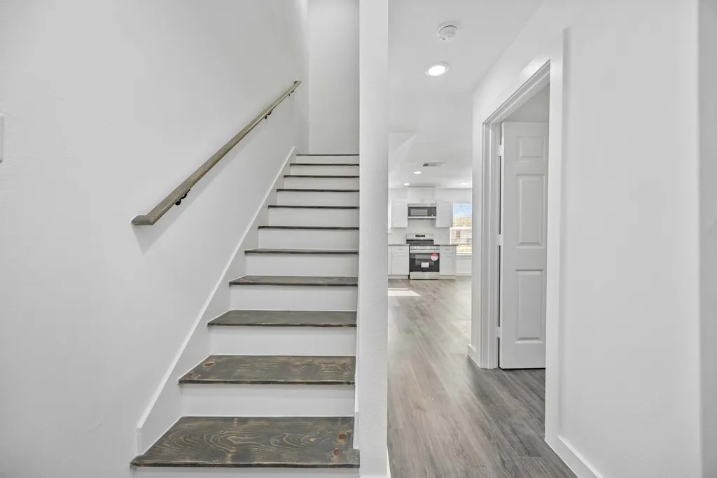 7811 Laura Koppe Road, Unit A Houston, TX 77028 - Photo 9 of 23 a view of entryway and hall with wooden floor