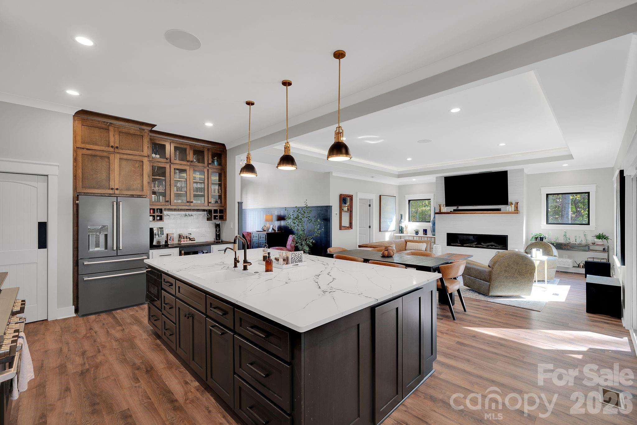 4111 Ridge Drive Northeast Conover, NC 28613 - Photo 13 of 39 a view of kitchen with kitchen island a sink a stove and chairs