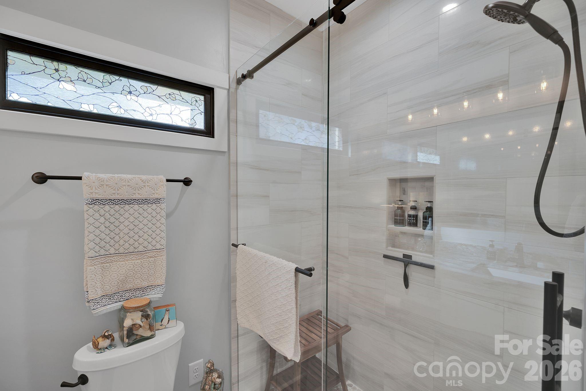 4111 Ridge Drive Northeast Conover, NC 28613 - Photo 19 of 39 a bathroom with a bathtub a shower a toilet and sink
