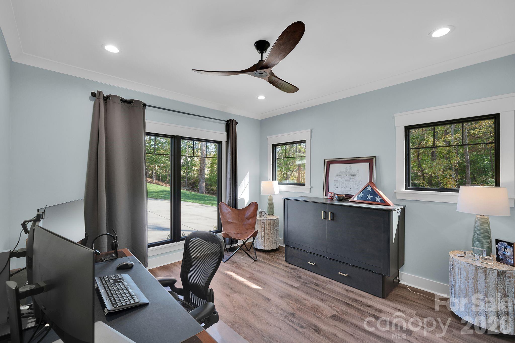 4111 Ridge Drive Northeast Conover, NC 28613 - Photo 20 of 39 a living room with furniture a window and a flat screen tv