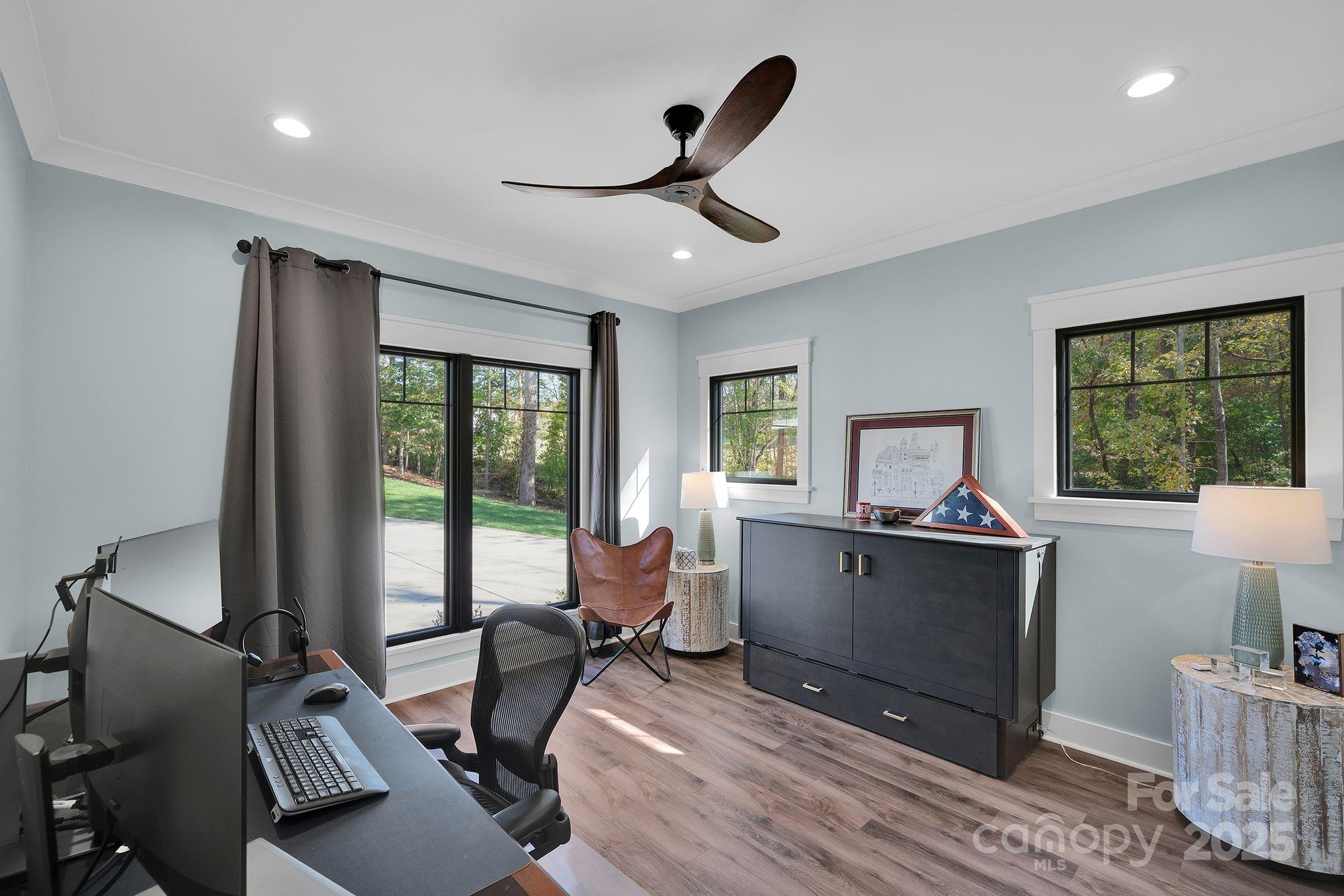 4111 Ridge Drive Northeast Conover, NC 28613 - Photo 20 of 39 a living room with furniture a window and a flat screen tv