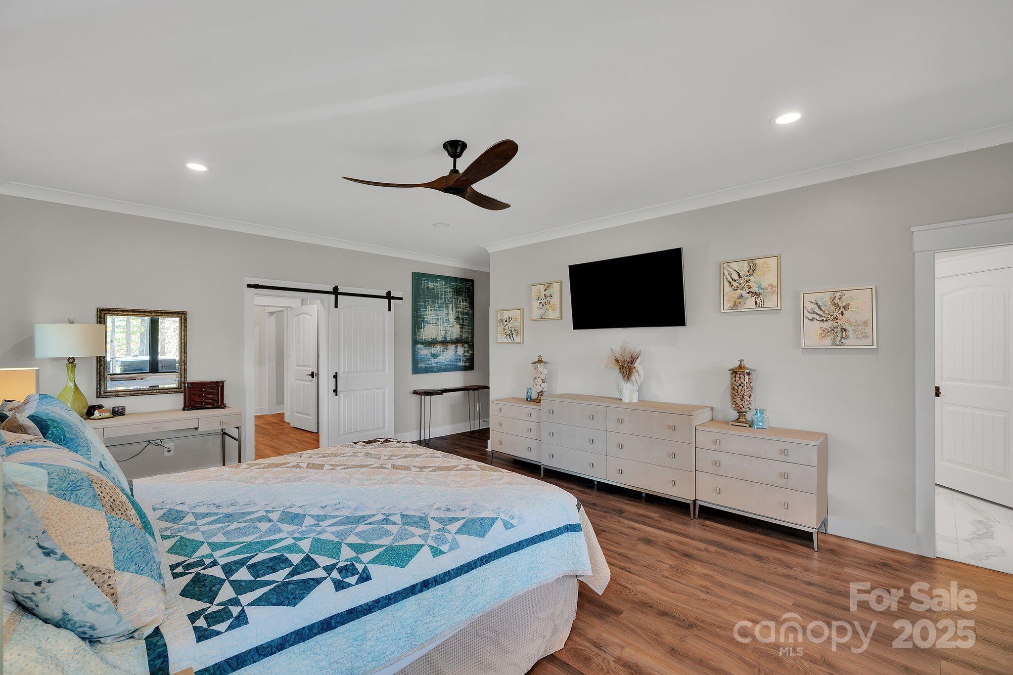 4111 Ridge Drive Northeast Conover, NC 28613 - Photo 21 of 39 a bedroom with a bed and a flat screen tv