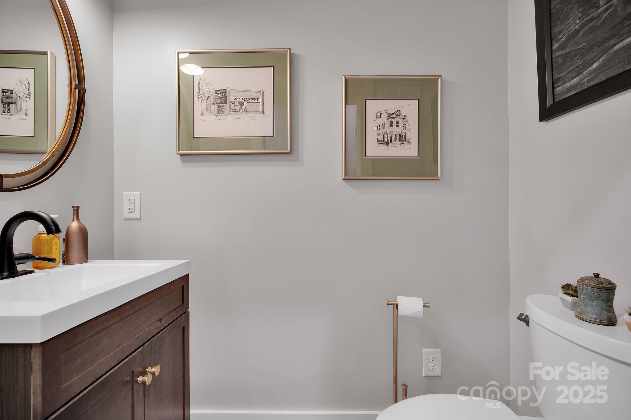 4111 Ridge Drive Northeast Conover, NC 28613 - Photo 28 of 39 a bathroom with a sink mirror and a toilet