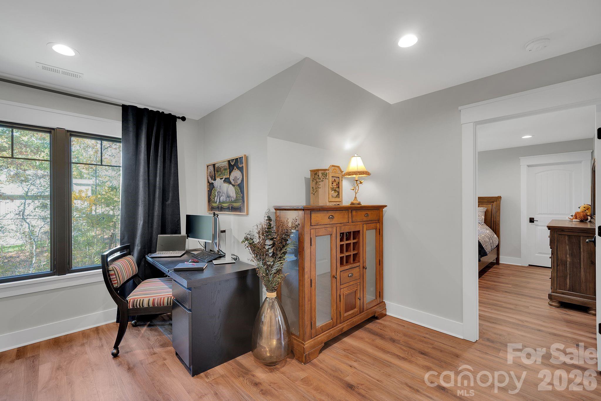 4111 Ridge Drive Northeast Conover, NC 28613 - Photo 29 of 39 a living room with furniture a rug and a large window