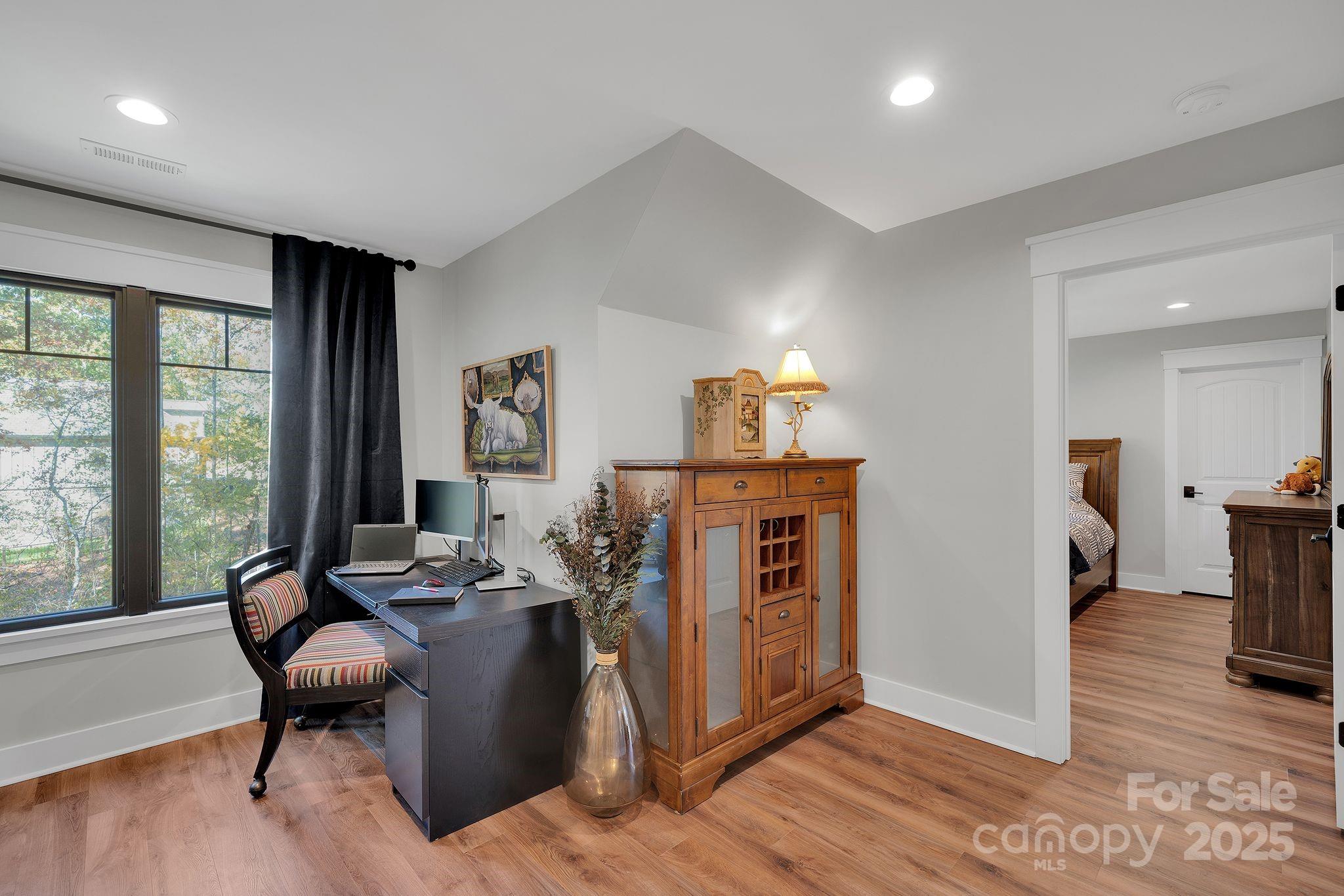 4111 Ridge Drive Northeast Conover, NC 28613 - Photo 29 of 39 a living room with furniture a rug and a large window