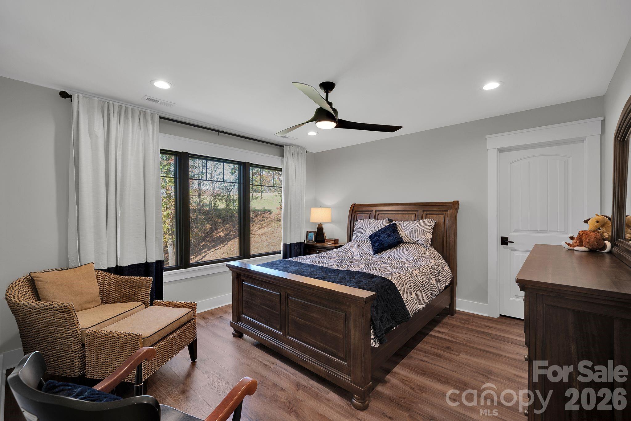 4111 Ridge Drive Northeast Conover, NC 28613 - Photo 30 of 39 a bedroom with a bed and a chandelier