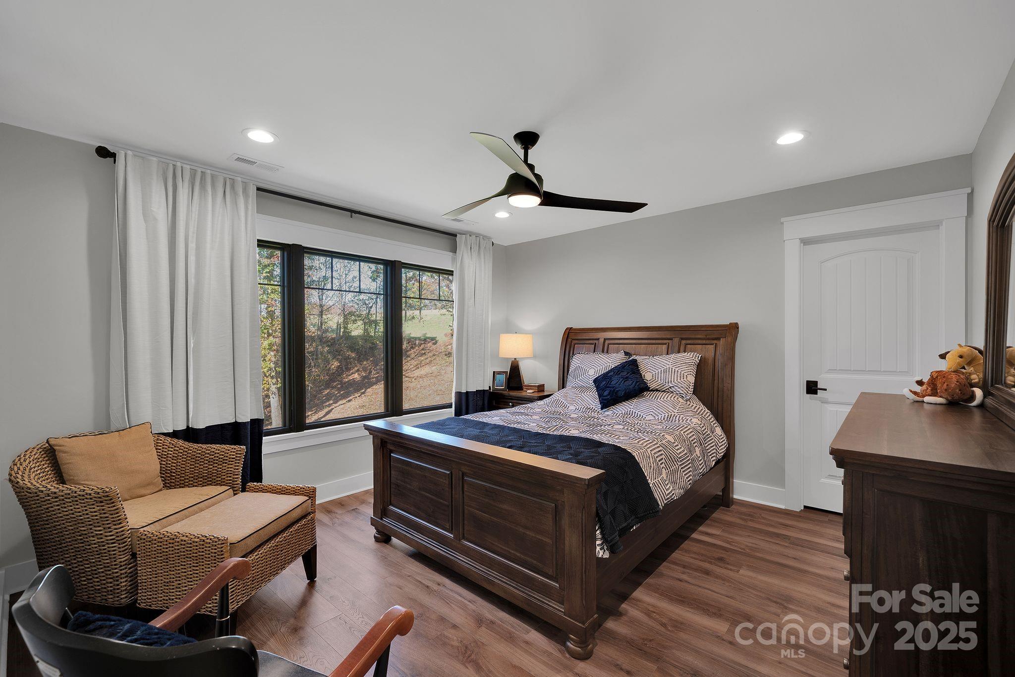 4111 Ridge Drive Northeast Conover, NC 28613 - Photo 30 of 39 a bedroom with a bed and a chandelier