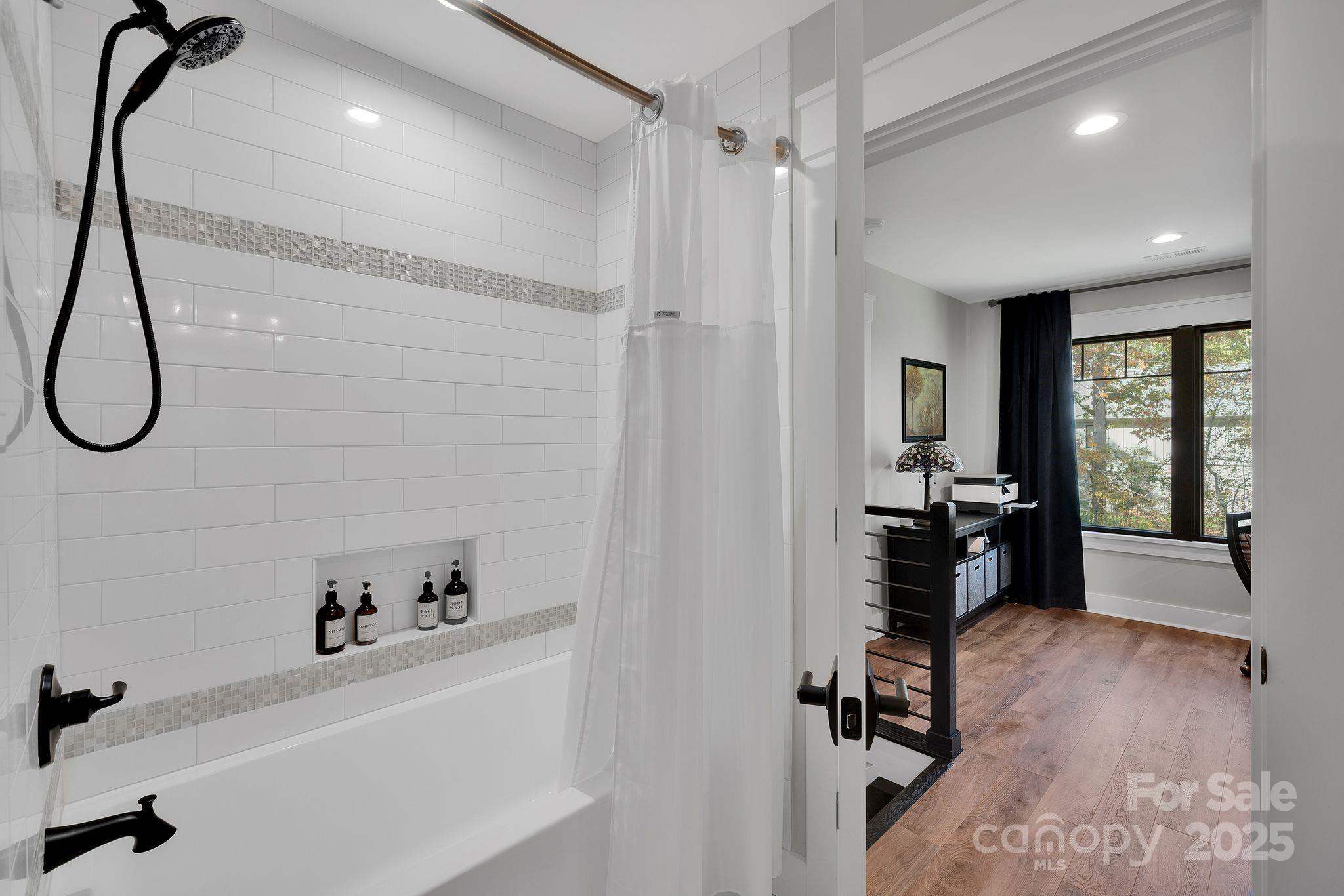 4111 Ridge Drive Northeast Conover, NC 28613 - Photo 32 of 39 a hallway with a lots of white furniture and a wooden floor