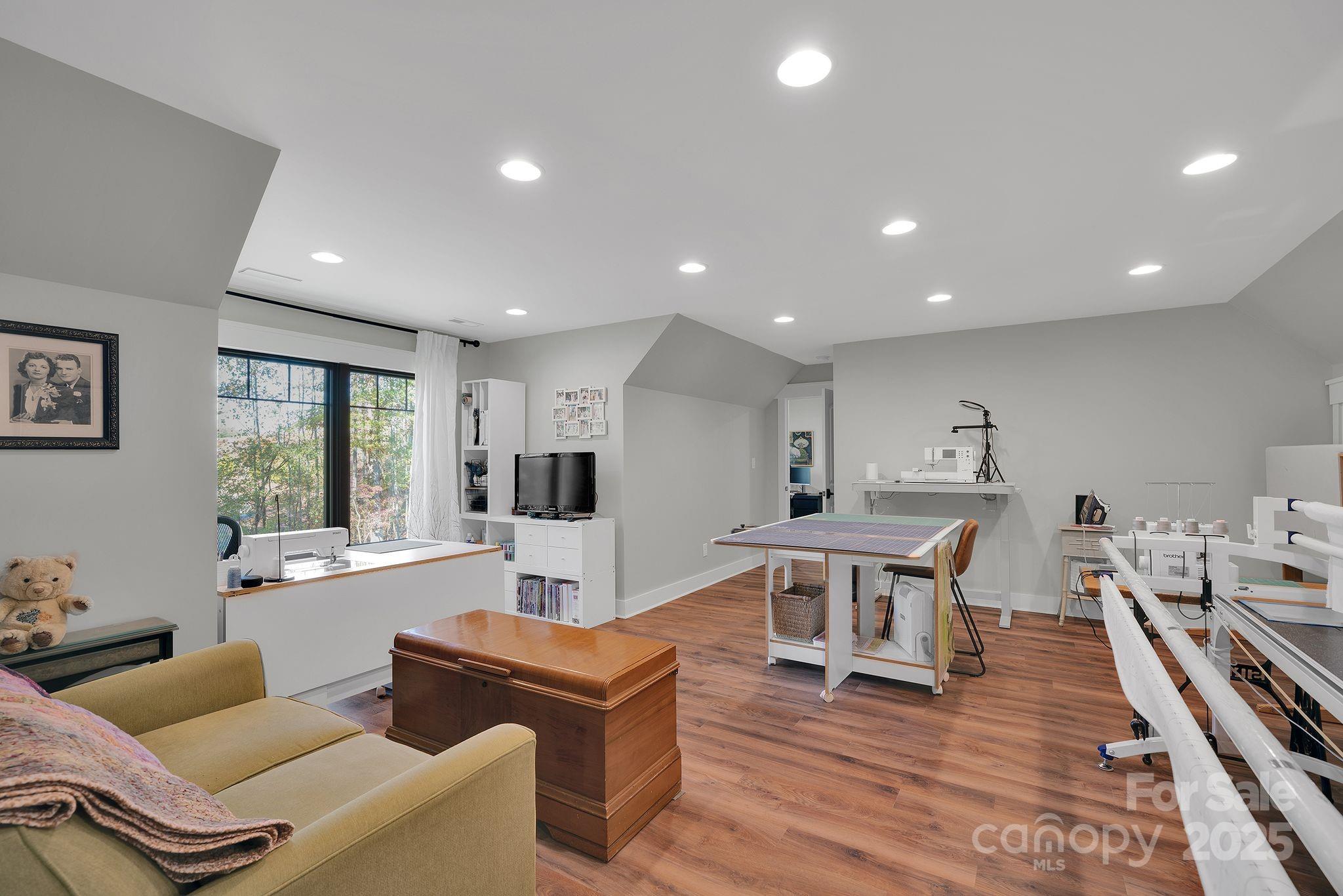 4111 Ridge Drive Northeast Conover, NC 28613 - Photo 33 of 39 a living room with furniture a wooden floor and a window