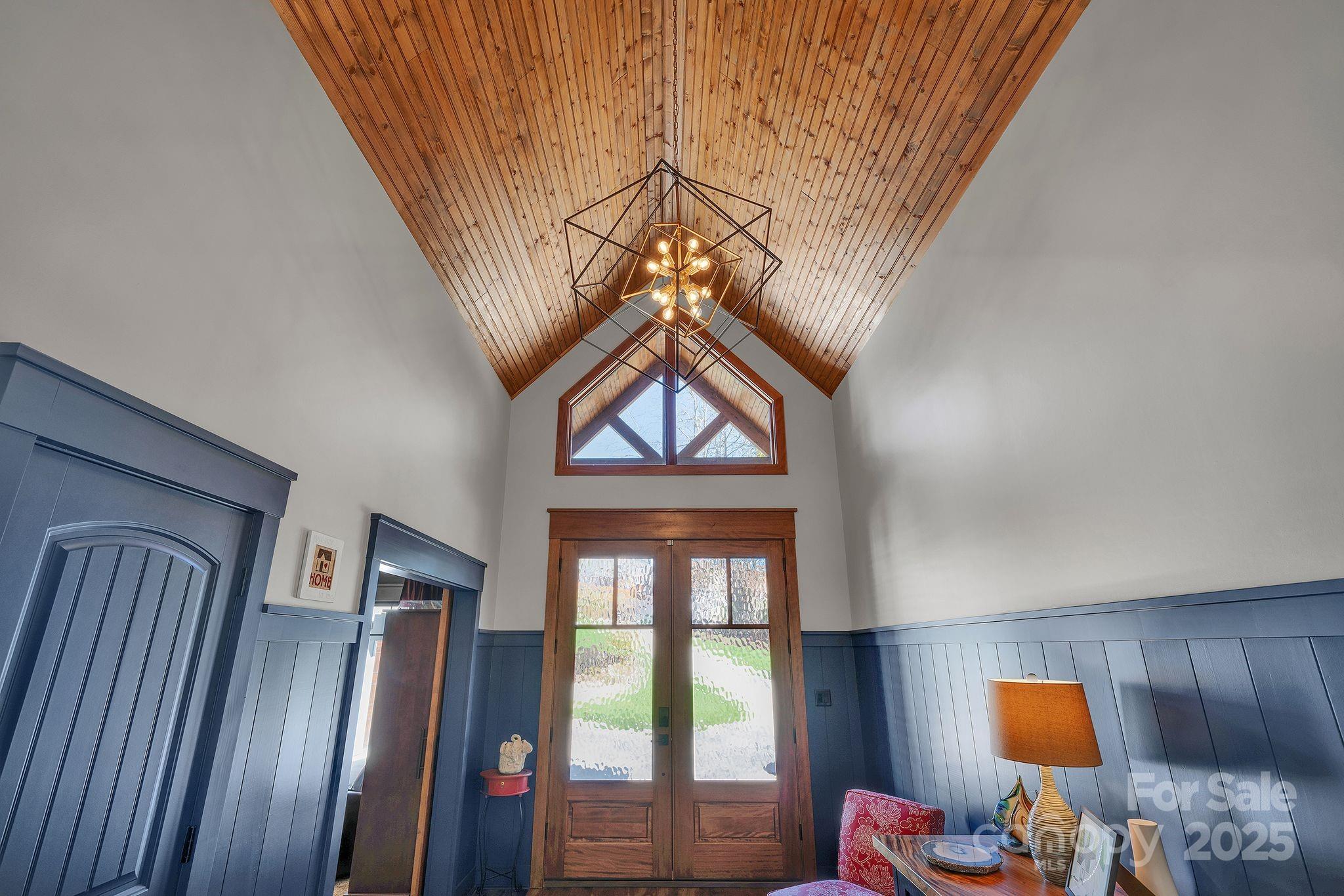 4111 Ridge Drive Northeast Conover, NC 28613 - Photo 8 of 39 a bedroom with a bed and a chandelier