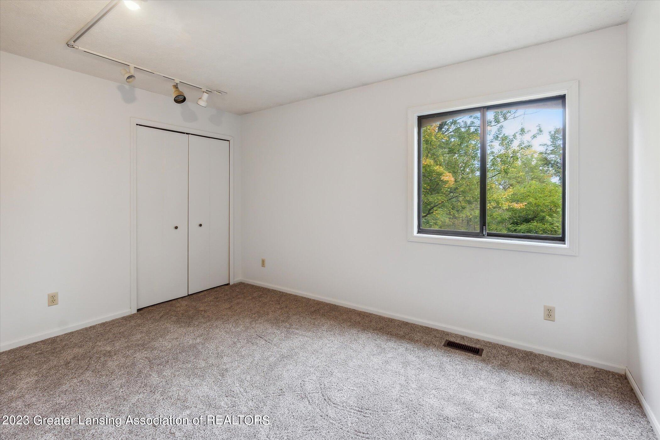 6496 Sleight Road Bath, MI 48808 - Photo 14 of 38 Primary Bedroom