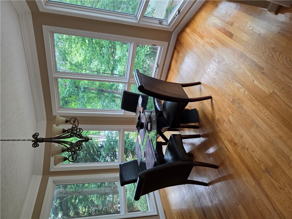214 Berwick Court Seneca, SC 29672 - Photo 38 of 39 This bright dining area offers abundant natural light and rich wood flooring.