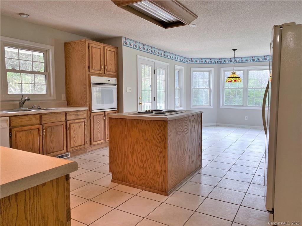 2641 Cameron Road Chester, SC 29706 - Photo 12 of 46 a kitchen with stainless steel appliances granite countertop a stove a sink and a refrigerator